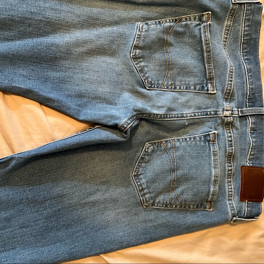 Mens Hollister bright dark wash distressed skinny jeans gently worn.